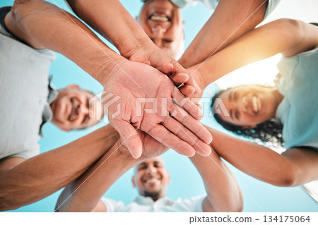 Happy family, trust and hands together below for teamwork, agreement or collaboration in solidarity. Group of people in community gathering piling hand for unity, celebration or love in partnership Happy family, trust and hands together below for teamwork, agreement or collaboration in solidarity. Group of people in community gathering piling hand for unity, celebration or love in partnership 134175064