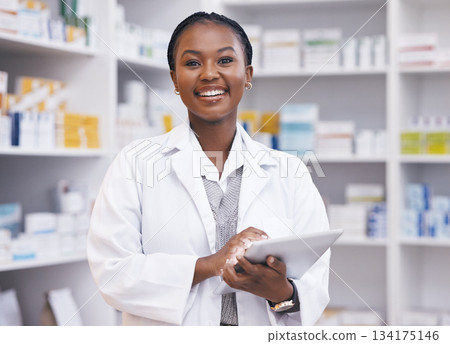 Portrait of black woman in pharmacy with tablet, smile and online inventory list for medicine on shelf. Happy female pharmacist, digital checklist and medical professional checking stock in store. Portrait of black woman in pharmacy with tablet, smile and online inventory list for medicine on shelf. Happy female pharmacist, digital checklist and medical professional checking stock in store. 134175146