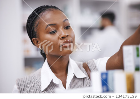 Pharmacy stock, woman and medication check of a customer in a healthcare and wellness store. Medical, retail and pharmaceutical label information checking of an African female person by a shop shelf 134175159