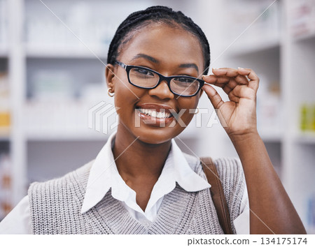 Smile, vision and portrait of happy woman with glasses in clinic for eye care, health and poor sight. Eyesight, face of girl holding designer brand frame and lens in hand, wellness and test for eyes 134175174