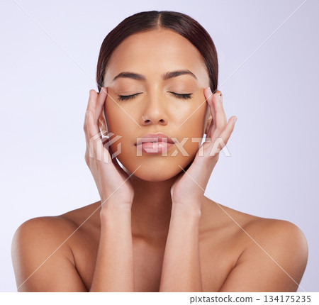 Woman, natural beauty and calm skincare in a studio with relax feeling from dermatology. Skin glow, facial and cosmetics makeup of a young female model with clean self care and face wellness Woman, natural beauty and calm skincare in a studio with relax feeling from dermatology. Skin glow, facial and cosmetics makeup of a young female model with clean self care and face wellness 134175235