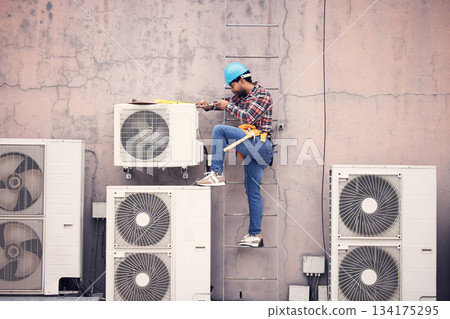 Black man, ac repair and technician, maintenance with engineering and fixing air conditioner with tools. Handyman, service and manual labor with male electrician, technology and helmet for safety Black man, ac repair and technician, maintenance with engineering and fixing air conditioner with tools. Handyman, service and manual labor with male electrician, technology and helmet for safety 134175295