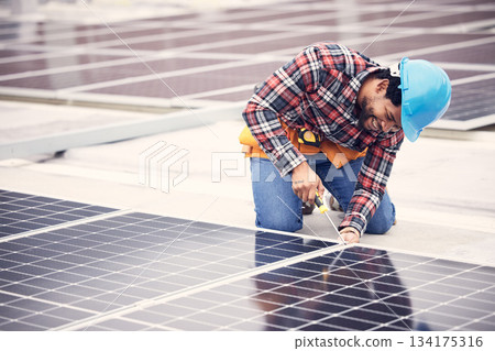 Solar panel, repair and engineering man on rooftop with tools, energy saving and sustainable power maintenance. African person, electrician contractor or technician working on photovoltaic generator 134175316