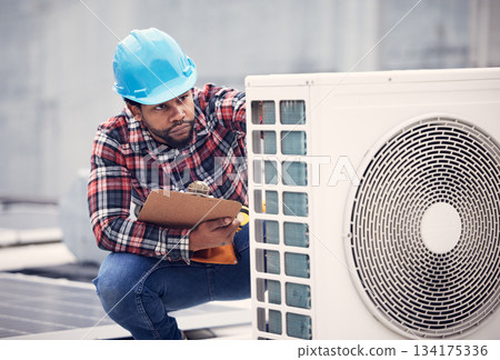 Black man, electrician with clipboard for air conditioner inspection, handyman working on rooftop with focus. Maintenance check, AC repair and male technician with power generator and service 134175336