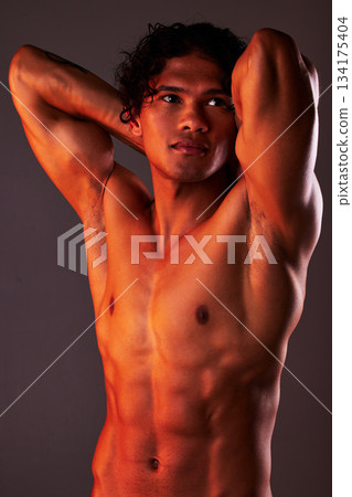 Man, sexy and torso body in studio for art, fitness or beauty of a person on a dark background. Face, strong muscle and male model with a six pack, glow and creative motivation for aesthetic backdrop Man, sexy and torso body in studio for art, fitness or beauty of a person on a dark background. Face, strong muscle and male model with a six pack, glow and creative motivation for aesthetic backdrop 134175404