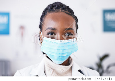 Doctor, portrait and covid mask on woman for healthcare, medical help and safety compliance in hospital. Face of professional African person with ppe health, wellness and medicine support in clinic Doctor, portrait and covid mask on woman for healthcare, medical help and safety compliance in hospital. Face of professional African person with ppe health, wellness and medicine support in clinic 134175414