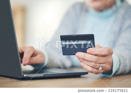 Laptop, credit card and hands typing for online shopping, digital banking or payment in home. Computer, ecommerce and woman on internet for sales, finance or fintech purchase, savings or investment. Laptop, credit card and hands typing for online shopping, digital banking or payment in home. Computer, ecommerce and woman on internet for sales, finance or fintech purchase, savings or investment. 134175621