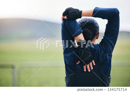 Sports, workout or female stretching arms for outdoor training in mockup race, marathon or competition. Fitness, health and back of a woman athlete runner doing a warm up exercise for nature running Sports, workout or female stretching arms for outdoor training in mockup race, marathon or competition. Fitness, health and back of a woman athlete runner doing a warm up exercise for nature running 134175714