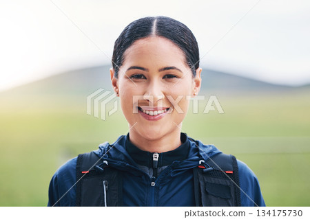 Fitness, portrait and happy woman in nature for hiking, training and morning cardio on blurred background. Face, smile and female on a hike outdoors, excited and cheerful in a park or countryside Fitness, portrait and happy woman in nature for hiking, training and morning cardio on blurred background. Face, smile and female on a hike outdoors, excited and cheerful in a park or countryside 134175730