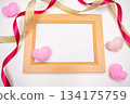 Wooden framed photo with pink and white hearts and ribbon 134175759