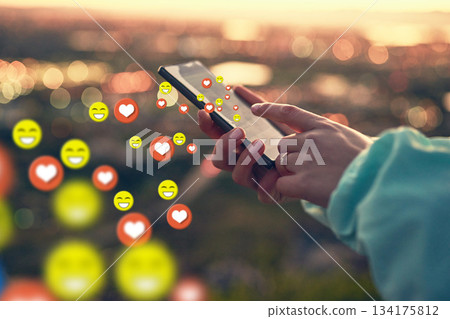 Hands, social media icon or girl with phone for communication, text chat or online dating. City sunset, emoticons overlay or woman on mobile app or digital network with love, like or heart emoji 134175812