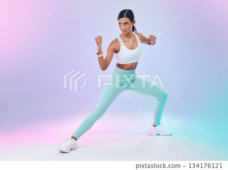 Fitness, woman and fighting pose in studio for karate, martial arts or defence training on gradient background. Power, sports and indian female in intense workout, exercise and posing while isolated Fitness, woman and fighting pose in studio for karate, martial arts or defence training on gradient background. Power, sports and indian female in intense workout, exercise and posing while isolated 134176121