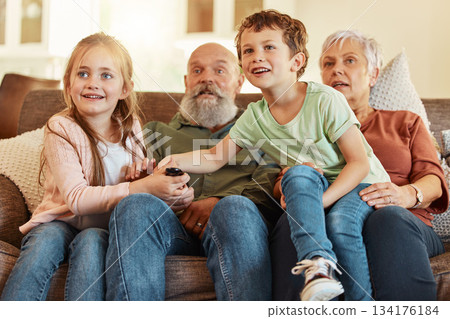 Grandparents, tv and children in a home living room streaming a web series together. Senior people, kids and television remote watching a video on a house lounge couch with a child film and movie 134176184