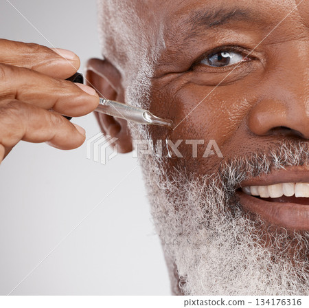 Skincare, serum and portrait of senior black man in studio for wellness, cosmetics and facial treatment. Dermatology, beauty and face of guy with oil dropper for anti aging, wrinkles and hydration Skincare, serum and portrait of senior black man in studio for wellness, cosmetics and facial treatment. Dermatology, beauty and face of guy with oil dropper for anti aging, wrinkles and hydration 134176316