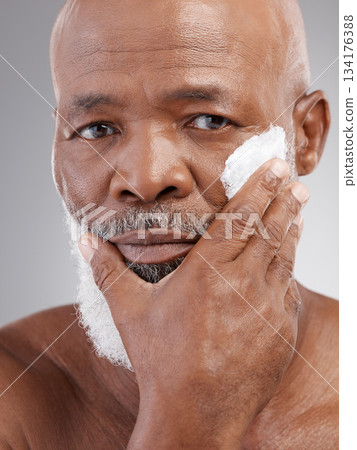 Beauty, cream and portrait of senior black man for wellness, skincare and facial care in studio. Dermatology, wellness and serious male person with lotion for anti aging, wrinkle and face moisturizer 134176388