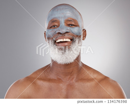 Skincare, clay mask and portrait of black man with smile, happiness and anti ageing treatment on studio background. Dermatology, cosmetic grooming and happy, mature model in charcoal skin care facial Skincare, clay mask and portrait of black man with smile, happiness and anti ageing treatment on studio background. Dermatology, cosmetic grooming and happy, mature model in charcoal skin care facial 134176398