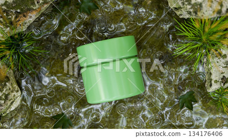 Green cream jar container mockup organic natural ingredient in water stream aside moss covered rock. 134176406