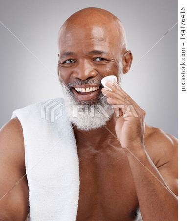 Dermatology, cotton pad and portrait of black man with smile, happiness and anti ageing treatment in studio backdrop. Skin care, cosmetic and happy, mature model with morning skincare or face routine Dermatology, cotton pad and portrait of black man with smile, happiness and anti ageing treatment in studio backdrop. Skin care, cosmetic and happy, mature model with morning skincare or face routine 134176416
