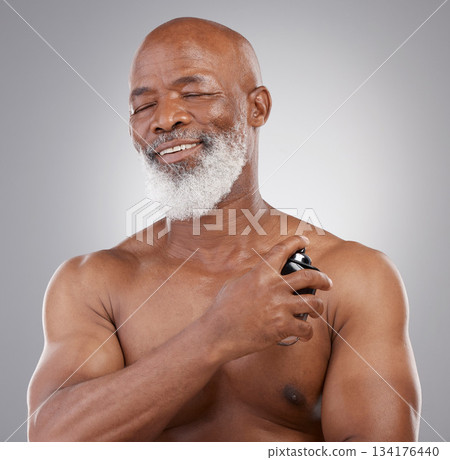 Perfume, smile and senior black man model closed eyes, happy and excited isolated in a gray studio background. Self care, skincare and old male person holding cologne for fragrance in backdrop Perfume, smile and senior black man model closed eyes, happy and excited isolated in a gray studio background. Self care, skincare and old male person holding cologne for fragrance in backdrop 134176440