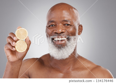 Senior black man, portrait smile and fruit for vitamin C, skincare or natural nutrition against gray studio background. Happy African American male and citrus lemon for healthy skin, diet or wellness Senior black man, portrait smile and fruit for vitamin C, skincare or natural nutrition against gray studio background. Happy African American male and citrus lemon for healthy skin, diet or wellness 134176446