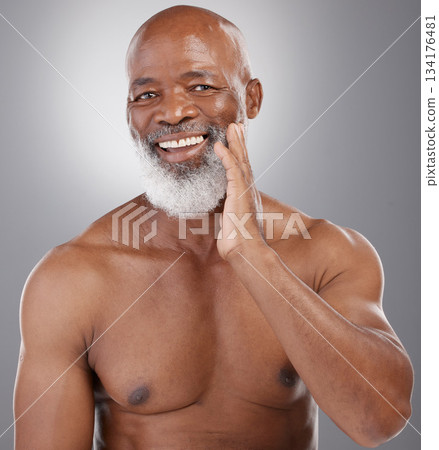 Senior black man, portrait smile and skincare for grooming, hygiene or facial treatment against gray studio background. Happy African American elderly male smiling for beauty skin, self love or care 134176481