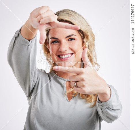 Happy woman, hands and frame for portrait selfie, photo or profile picture against a white studio background. Female border face and smiling in focus for perfect photography, social media or capture Happy woman, hands and frame for portrait selfie, photo or profile picture against a white studio background. Female border face and smiling in focus for perfect photography, social media or capture 134176627