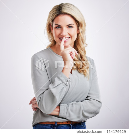 Thinking, portrait and problem solving with a woman on a gray background in studio for contemplation. Idea, choice and decision with an attractive young female contemplating in thoughtful wonder 134176629