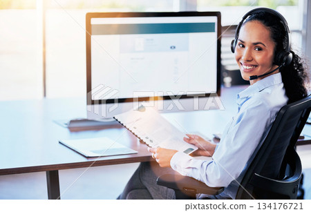 Woman, call center or computer screen in portrait with smile, documents or happy crm, contact us or customer service. Consultant, paperwork or listen to voip for tech support, advice or telemarketing 134176721