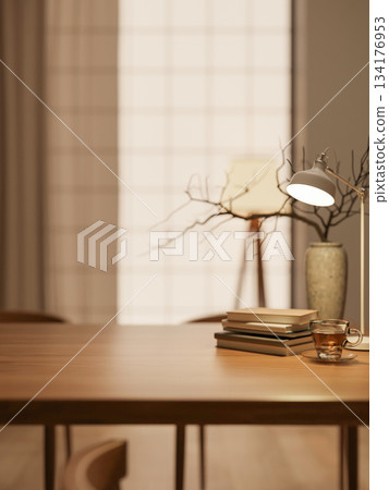 Coffee in glass cup with book and vase aside lamp on wooden table across wall window in warm light. 134176953