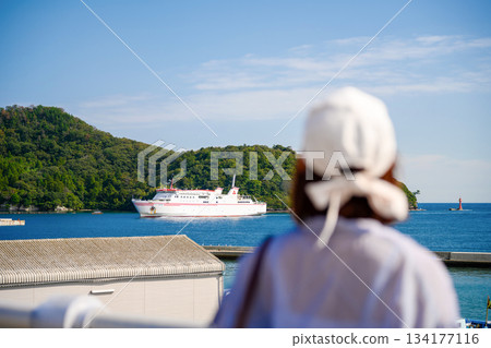 Ferry and woman at the port Ferry and woman at the port 134177116