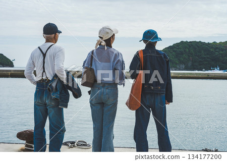 Three people traveling at the harbor Three people traveling at the harbor 134177200