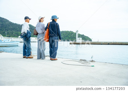 Port view and tourists Port view and tourists 134177203