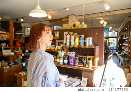 Woman shopping at a general store 134177263