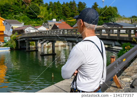 Port scenery and tourists Port scenery and tourists 134177357