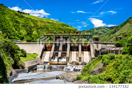 Agoyan Hydroelectric Dam stands on Pastaza River near Banos de Agua Santa, Ecuador. Concrete structure generates renewable energy in lush green Andean valley 134177382