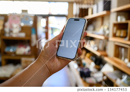 Smartphone operation at a general store 134177453