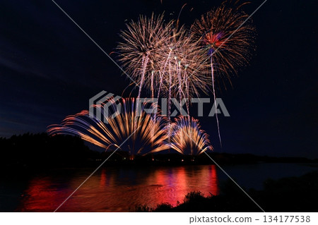 Fireworks reflected in the water Fireworks reflected in the water 134177538