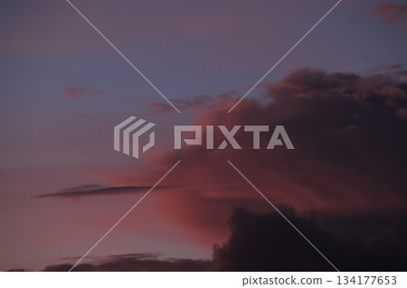 Deep purple dramatic storm clouds twilight sunset sky background 134177653