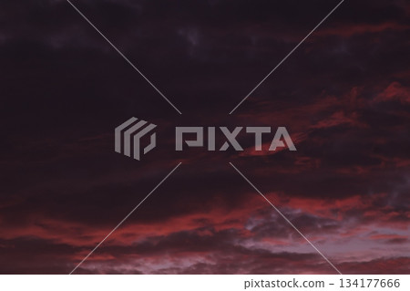 Dark ominous sky with dramatic red sunset clouds background. Dark ominous sky with dramatic red sunset clouds background. 134177666