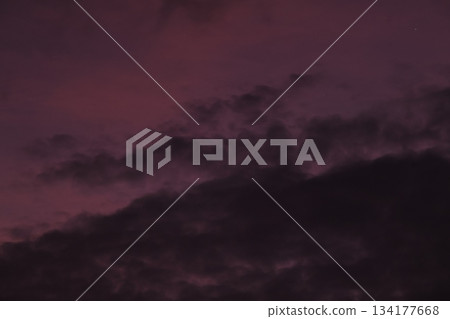 Moody dark purple clouds background at twilight sky 134177668