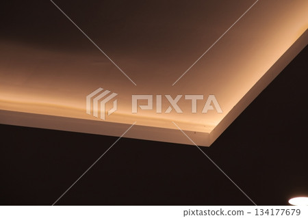 Warm ambient lighting design on modern interior ceiling structure. Warm ambient lighting design on modern interior ceiling structure. 134177679