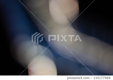Abstract futuristic dark blue and beige bokeh background overlay with strong light lines 134177989
