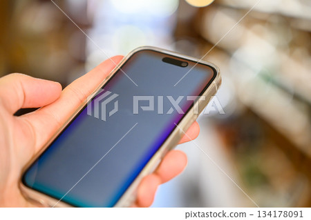 Smartphone in hand Smartphone in hand 134178091