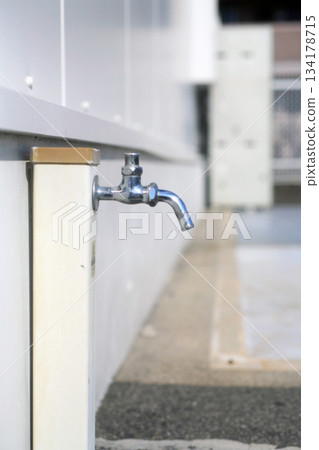 Water tap outside the store 134178715