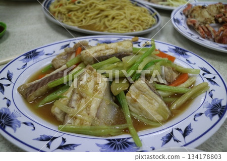 Celery and carrot stir-fried with flounder 134178803