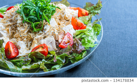 Tofu and crispy small sardine salad 134178834