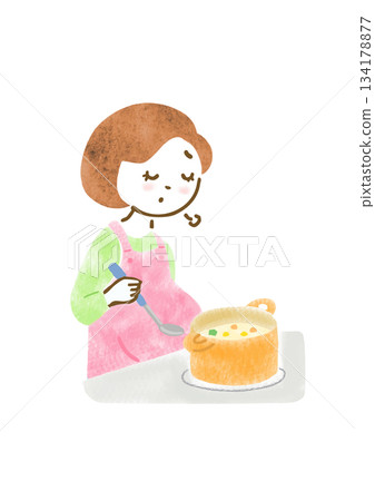 圖：一位孕婦圍著圍裙煮飯，表情疲憊。 134178877