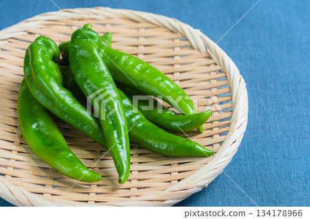 Manganji peppers served in a colander 134178966