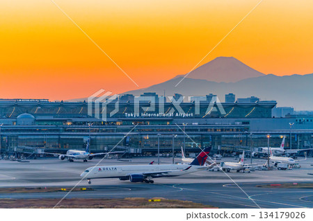 [Tokyo] Evening view of Haneda Airport Terminal 3 with Mount Fuji in the background 134179026