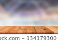 wooden board over blurred abstract background 134179300